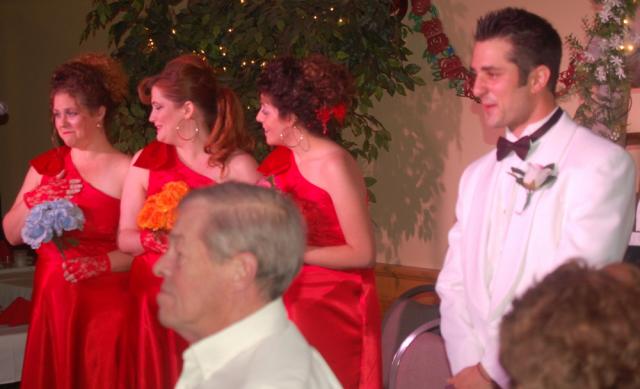 Bridesmaids and groom reacting to bride's words